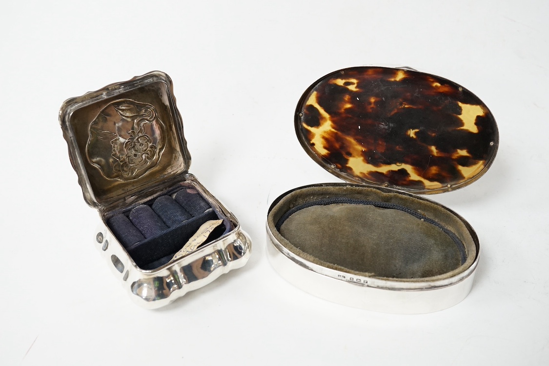 A late Victorian Art Nouveau silver small trinket box, by Horton & Allday?, Birmingham, 1900, 67mm, embossed with the bust of a lady, together with a George V silver and tortoiseshell pique mounted oval trinket box, Levi